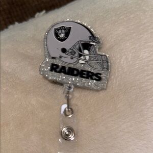 Raiders Silver and Black Badge Reel